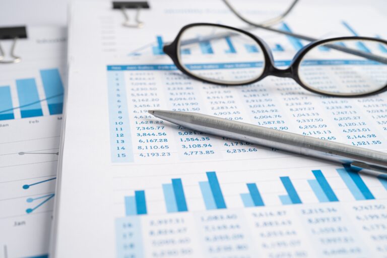 Pen on preadsheet table paper. Finance development, Banking Account, Statistics Investment Analytic research data economy, trading, office reporting Business company concept.